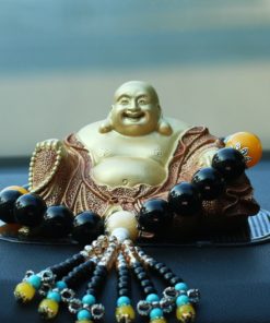 Tượng Di Lặc bằng đồng để oto ý nghĩa