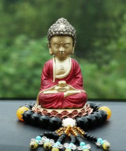 Tượng Phật A Di Đà để trên taplo xe hơi